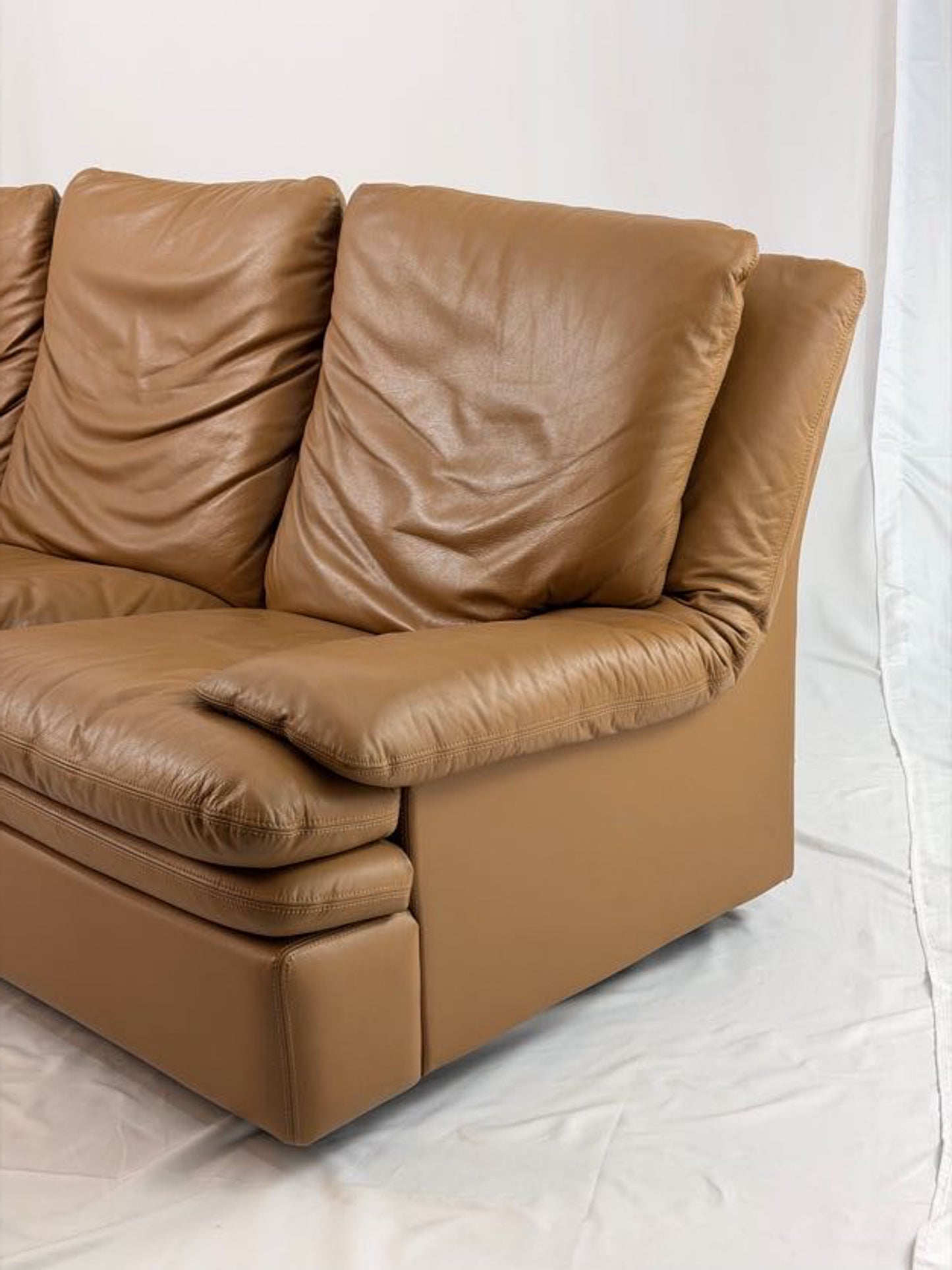 Brown leather sofa on a white background