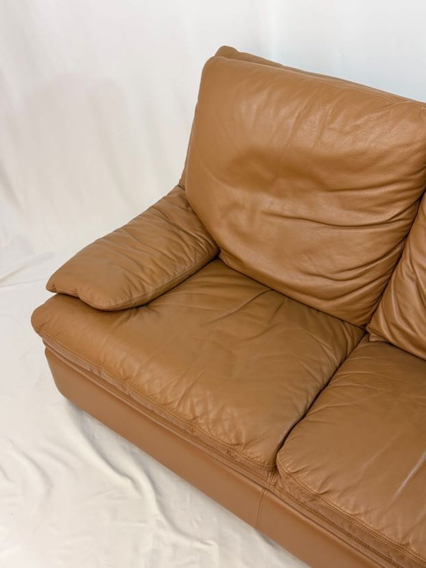 Brown leather sofa on a white background