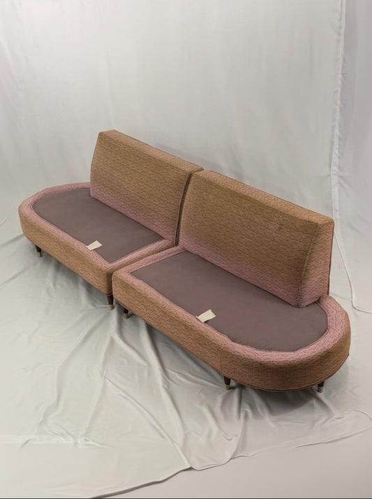 pink sectional sofa on a white background
