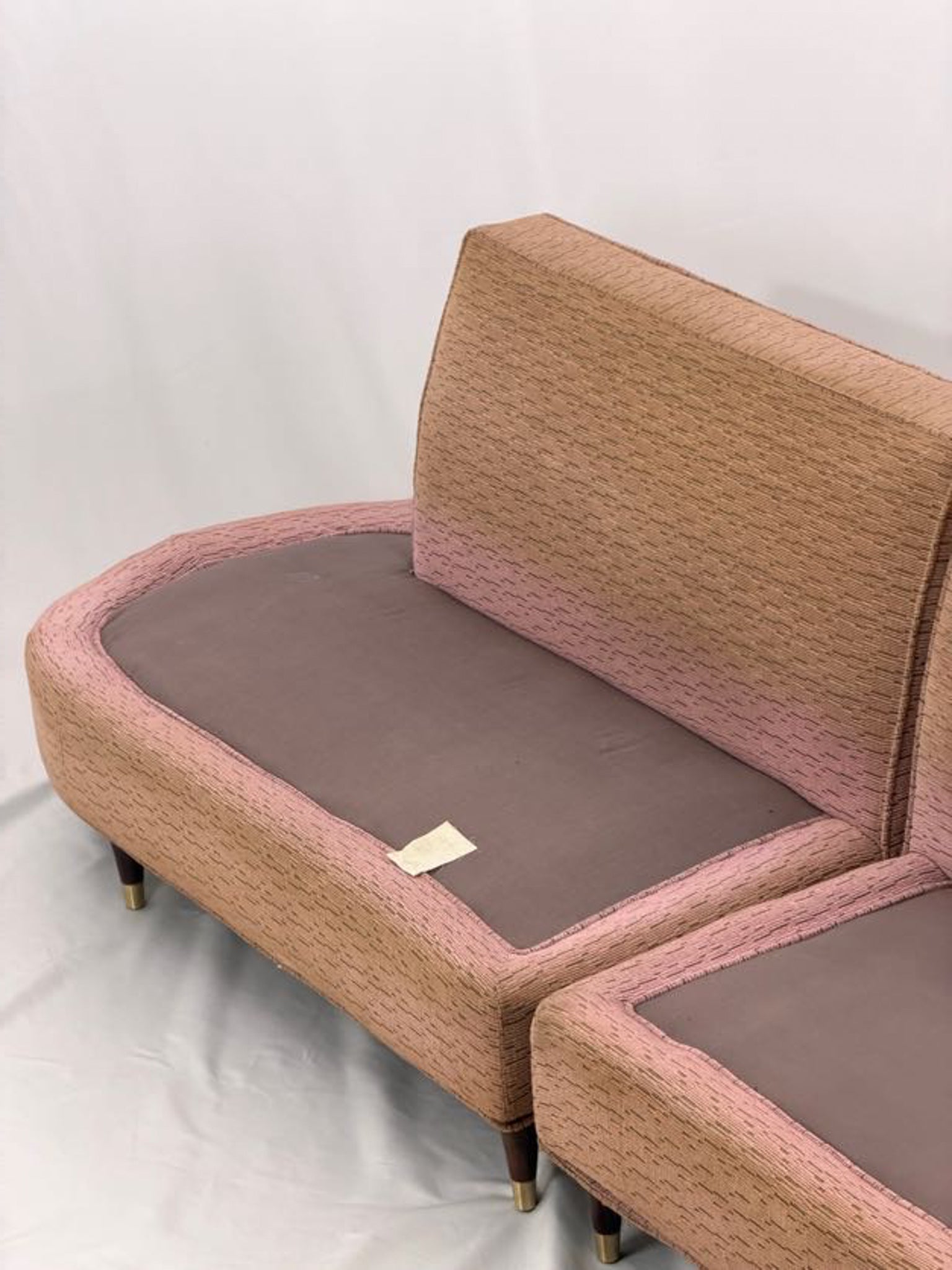 pink sectional sofa on a white background