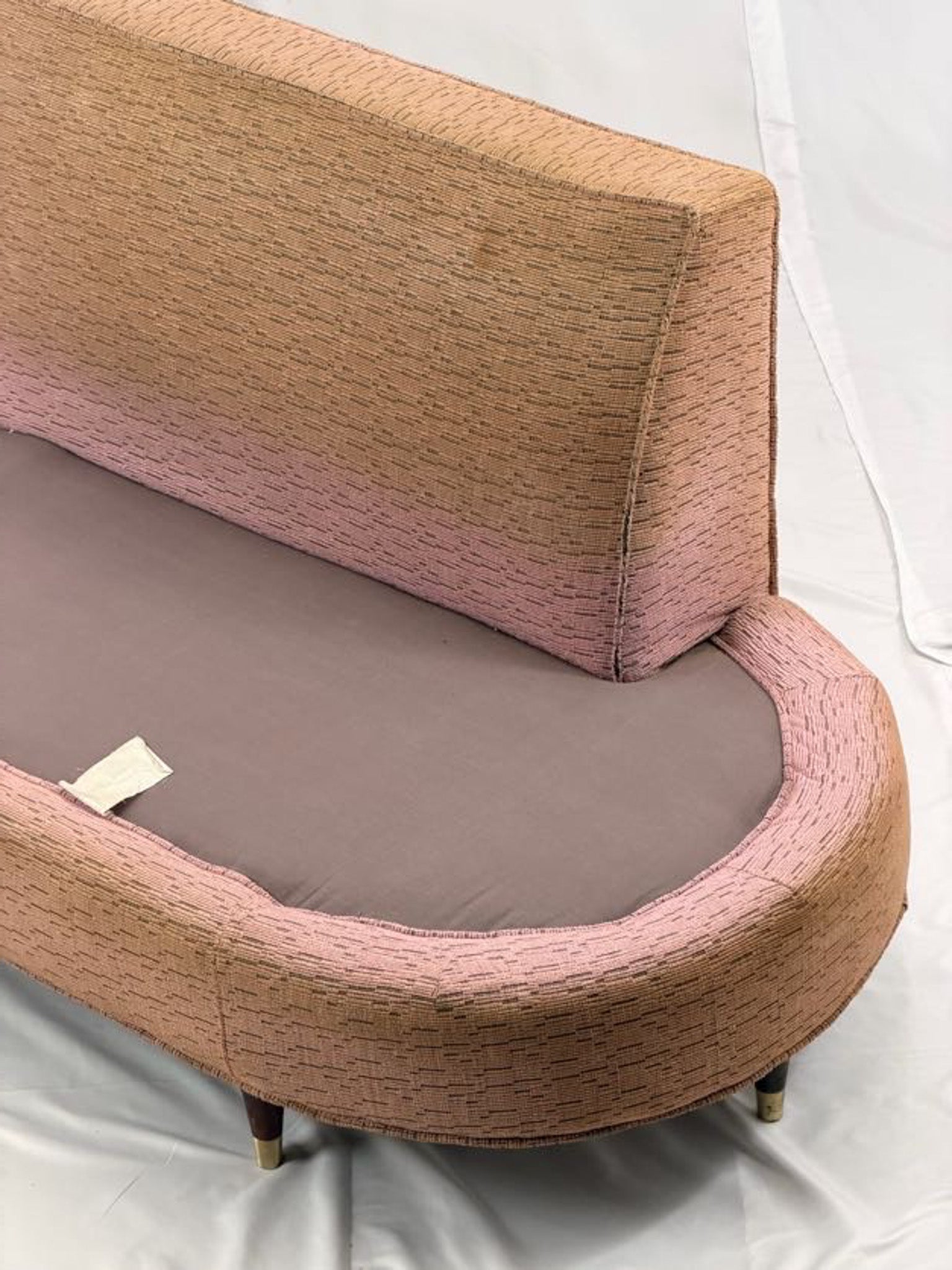 pink sectional sofa on a white background