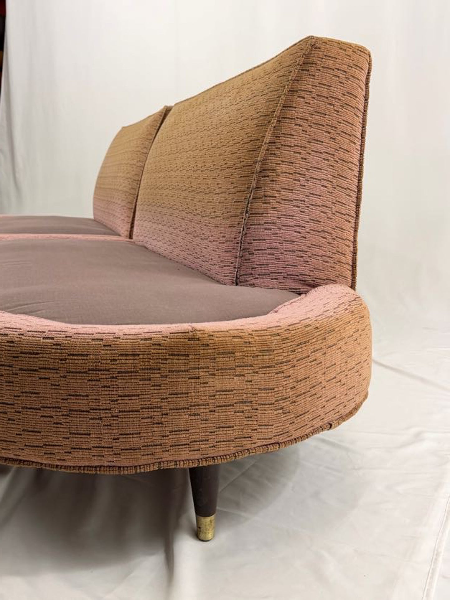 pink sectional sofa on a white background