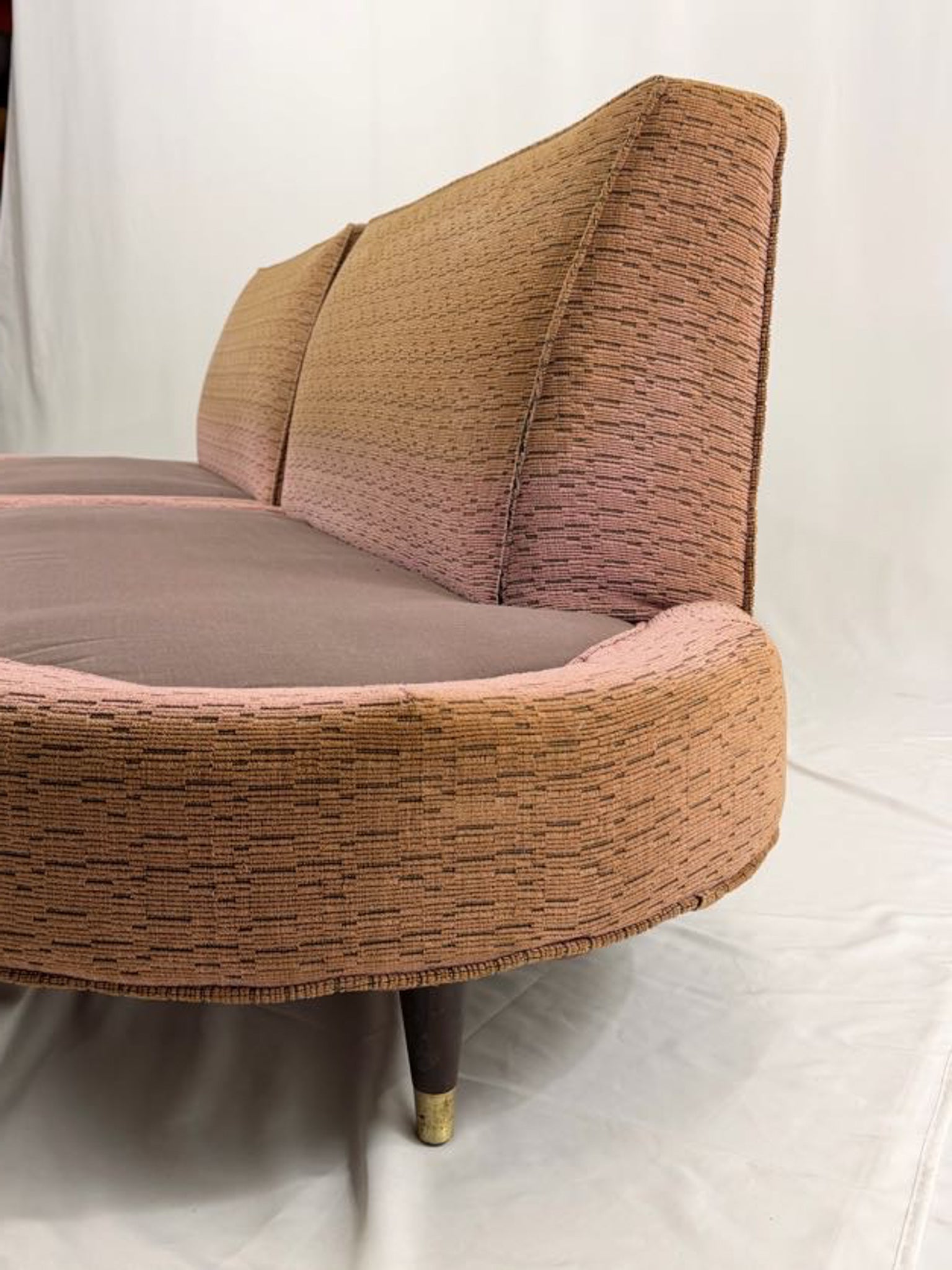 pink sectional sofa on a white background