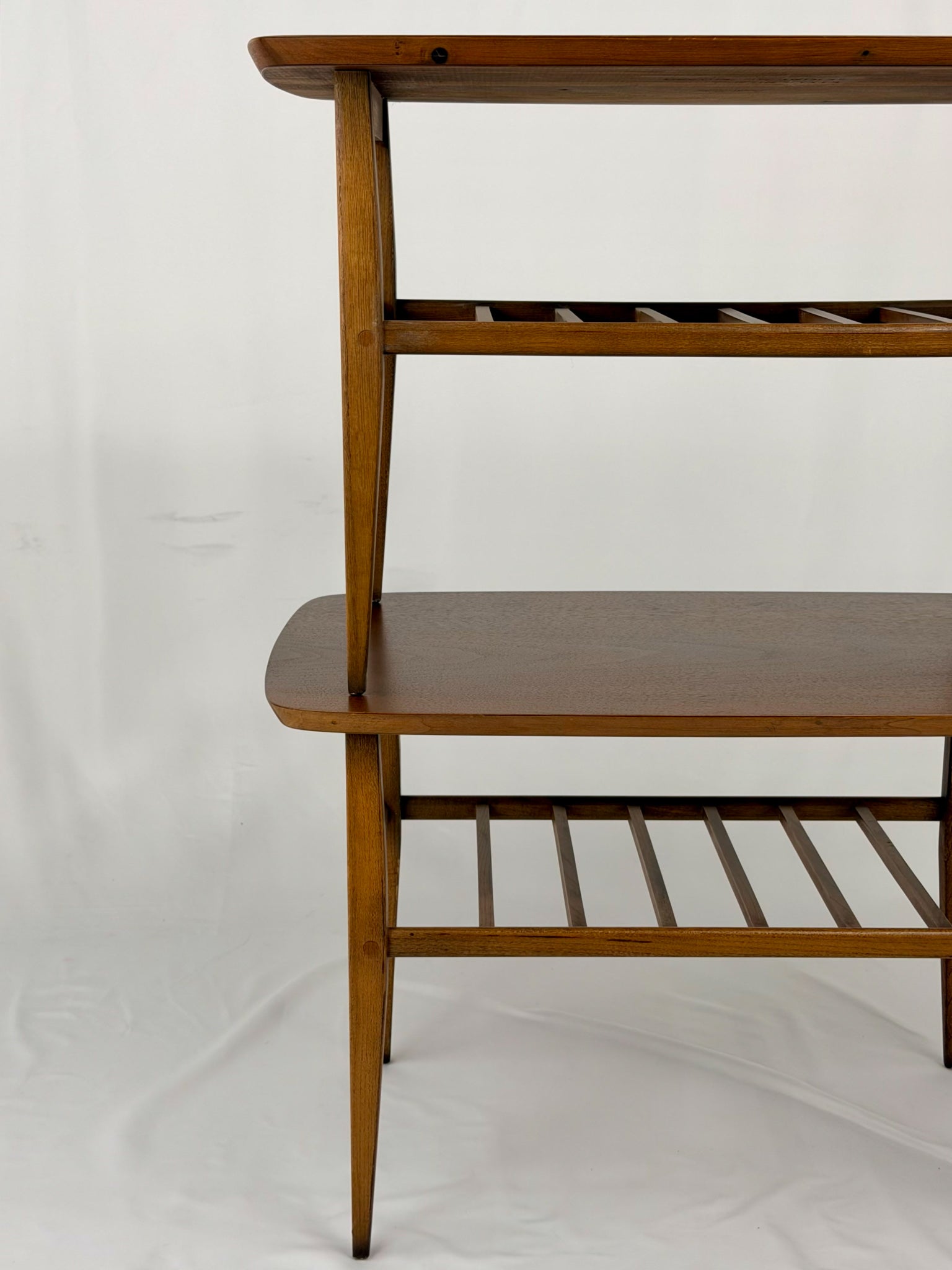 Two wooden side tables on a white background