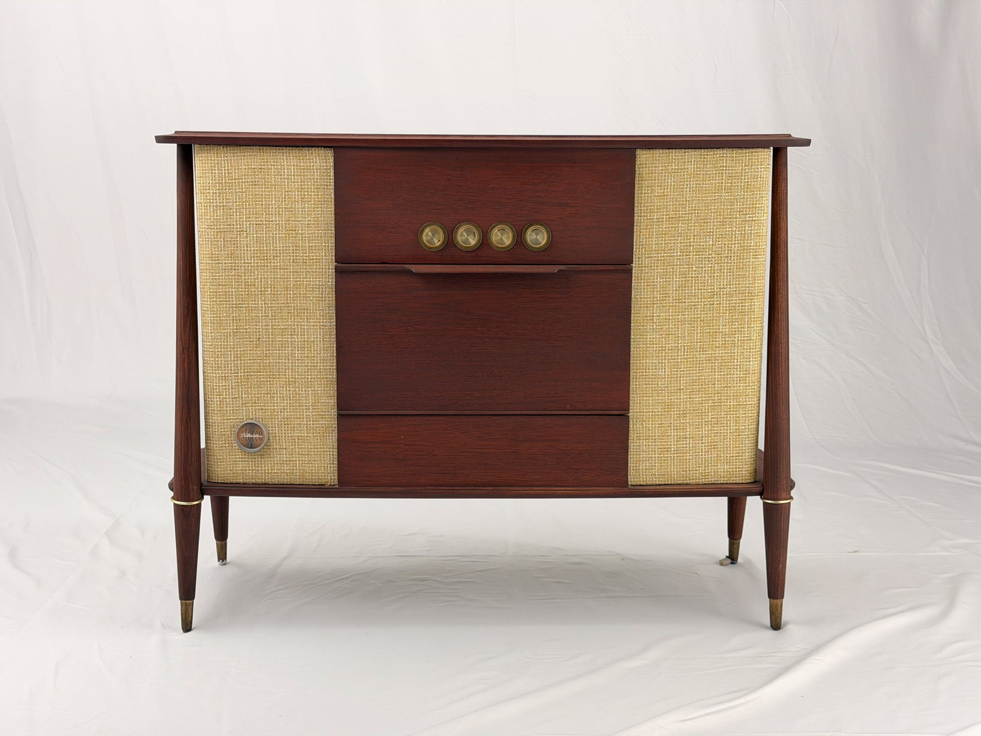 Vintage-style wooden console with beige textured panels on a white background