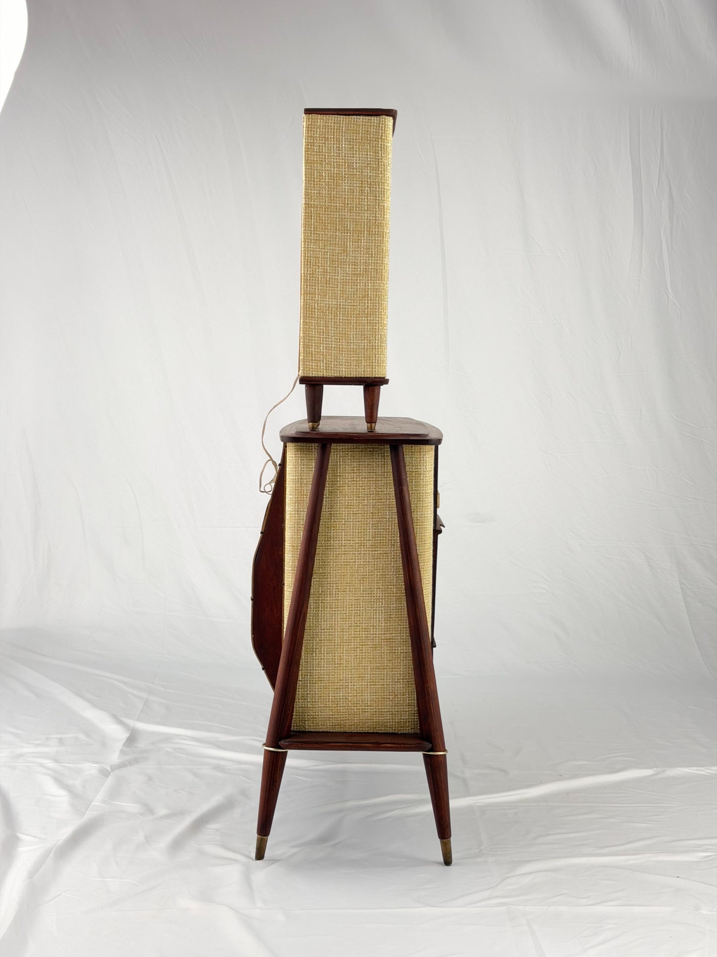 Vintage-style wooden console with beige textured panels on a white background