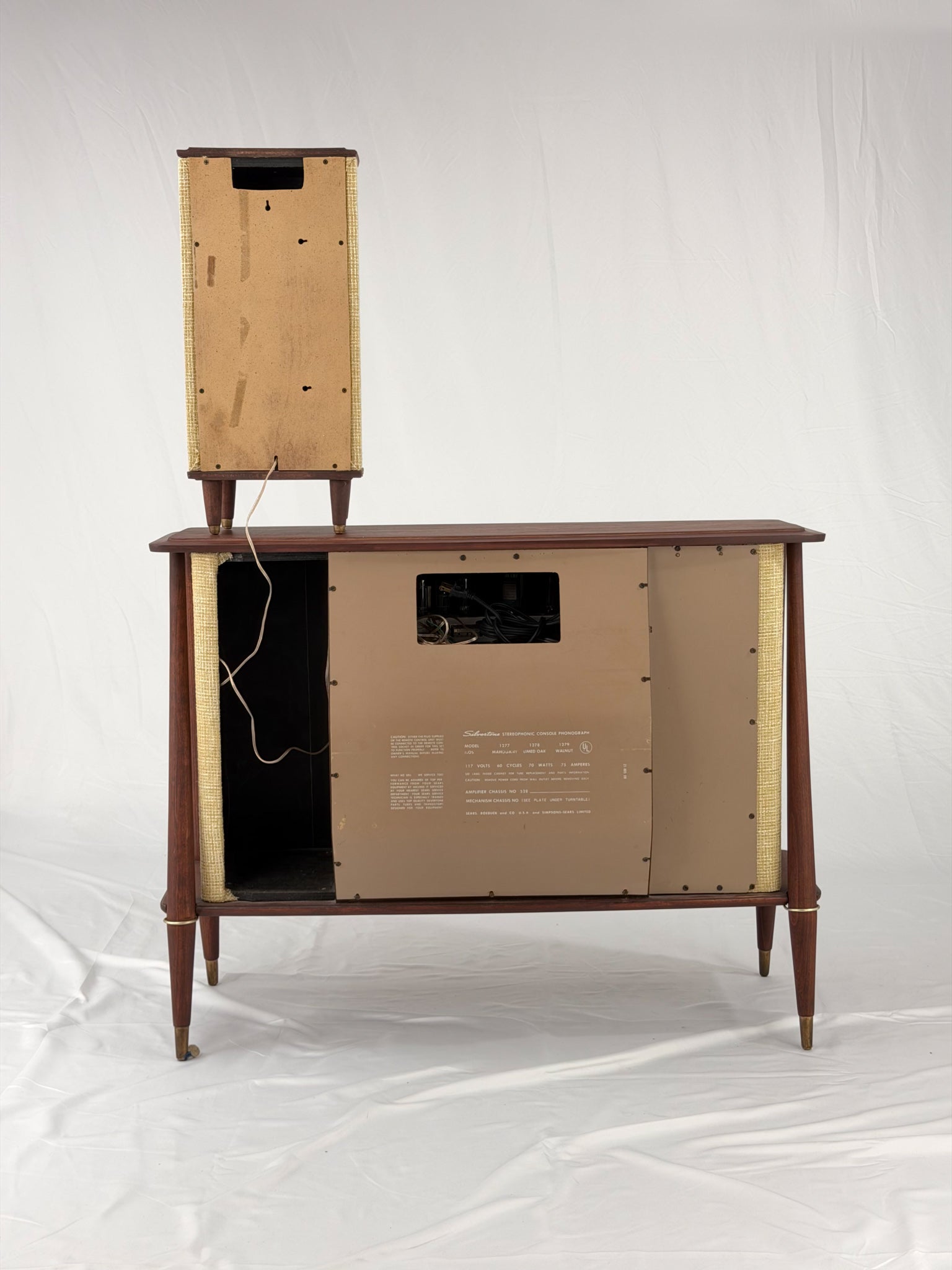 Vintage-style wooden console with beige textured panels on a white background