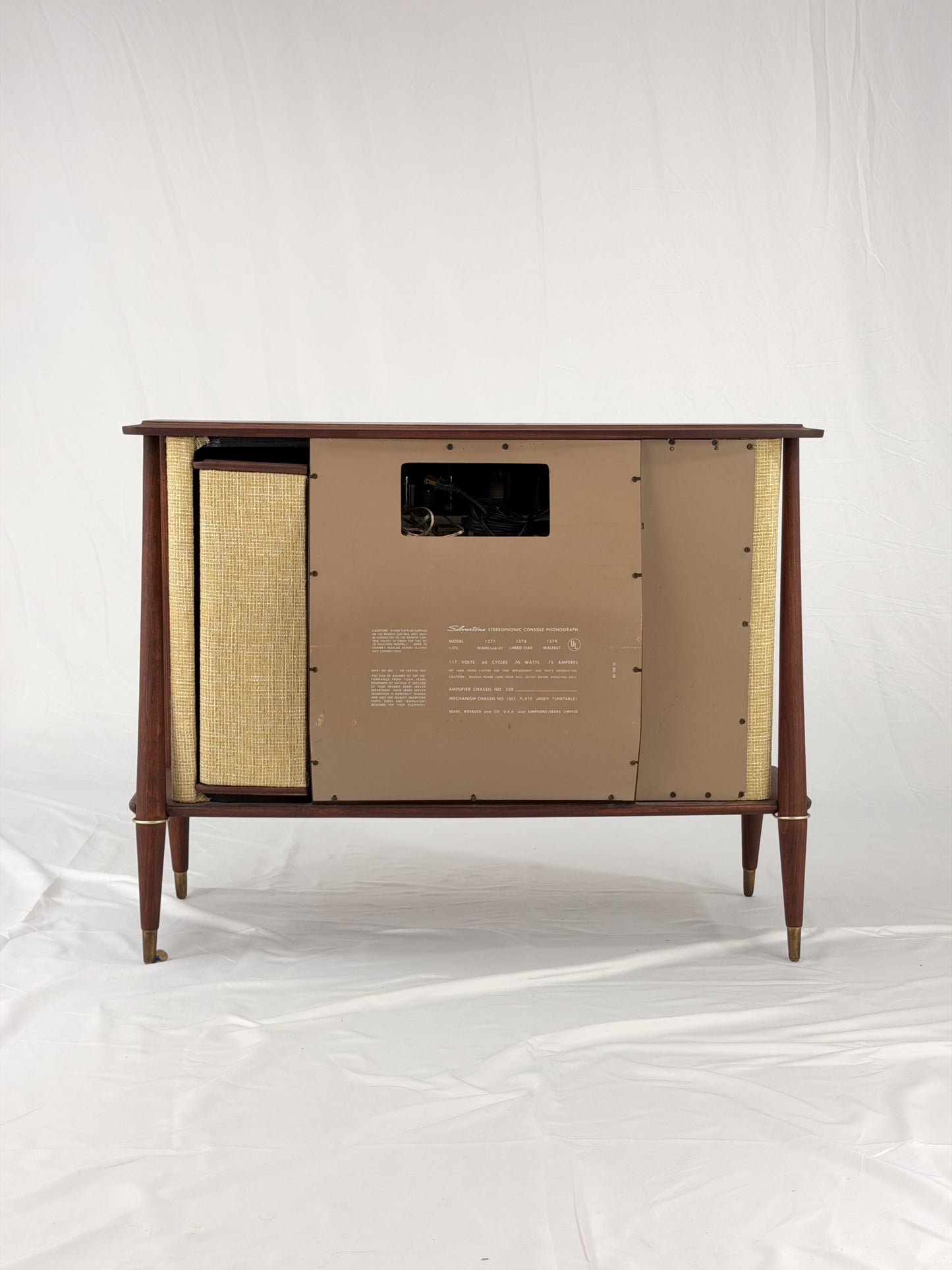 Vintage-style wooden console with beige textured panels on a white background