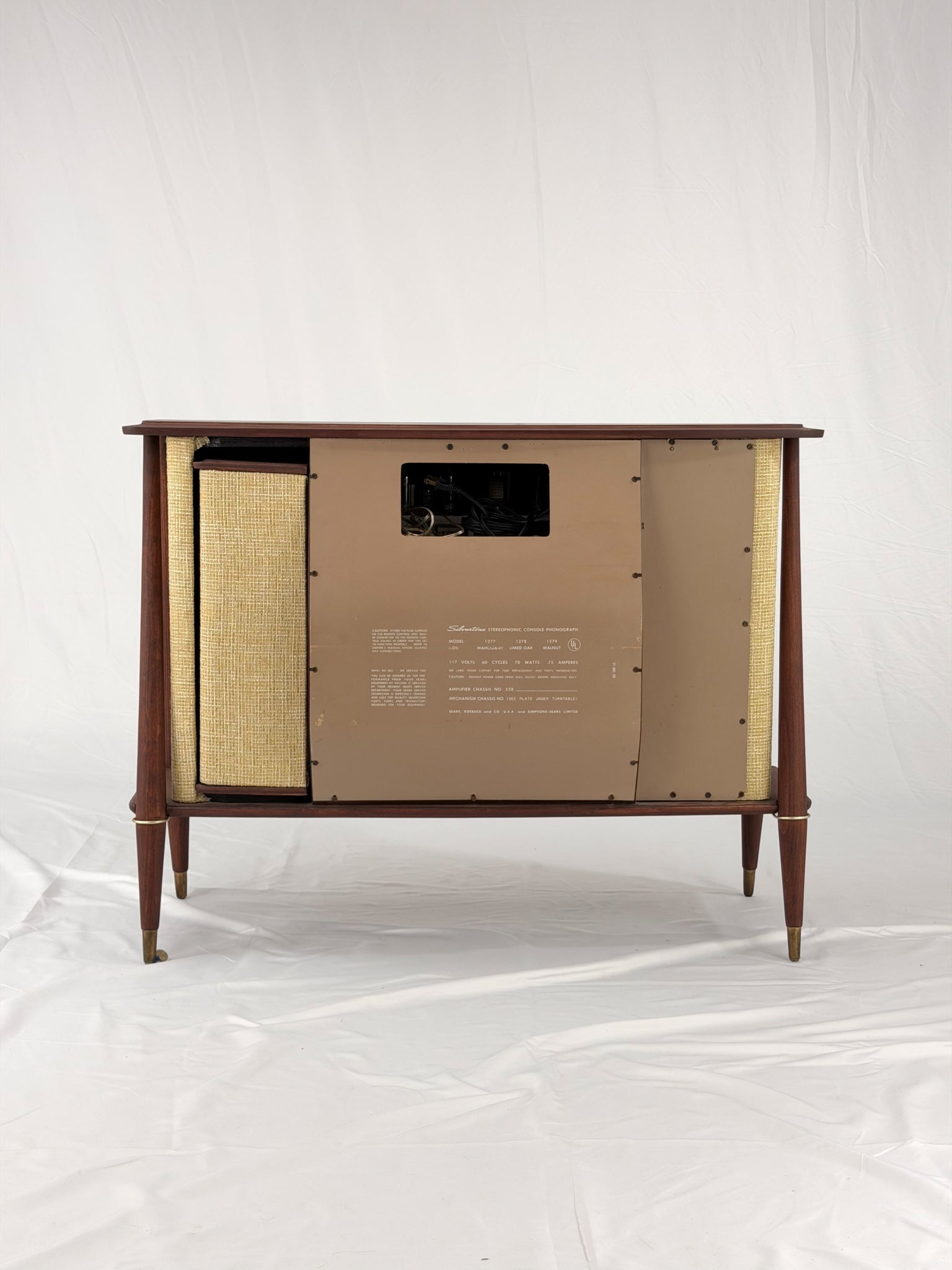 Vintage-style wooden console with beige textured panels on a white background