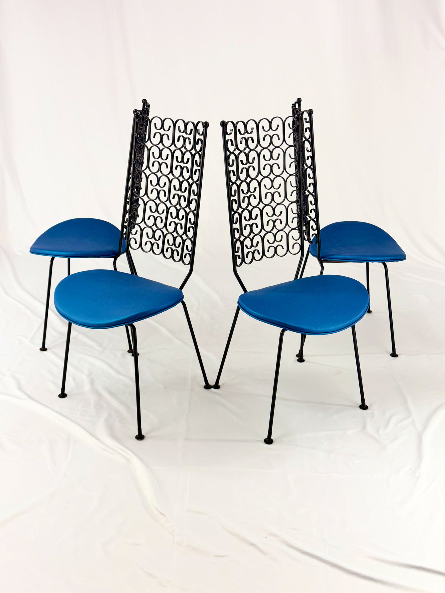 Blue chairs with black metal frames on a white background