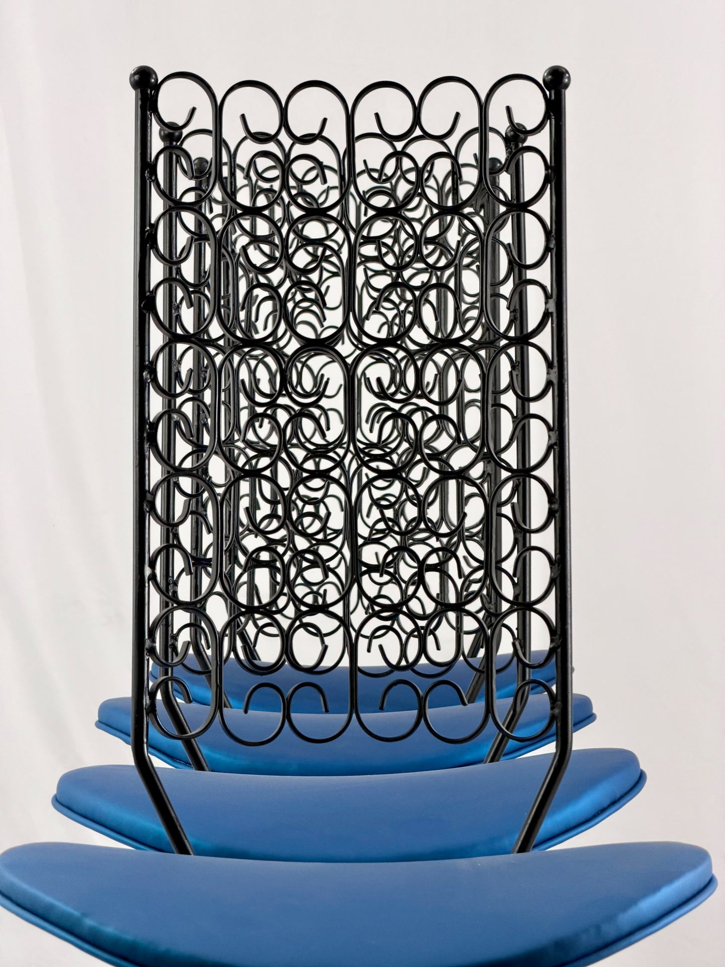 Blue chairs with black metal frames on a white background