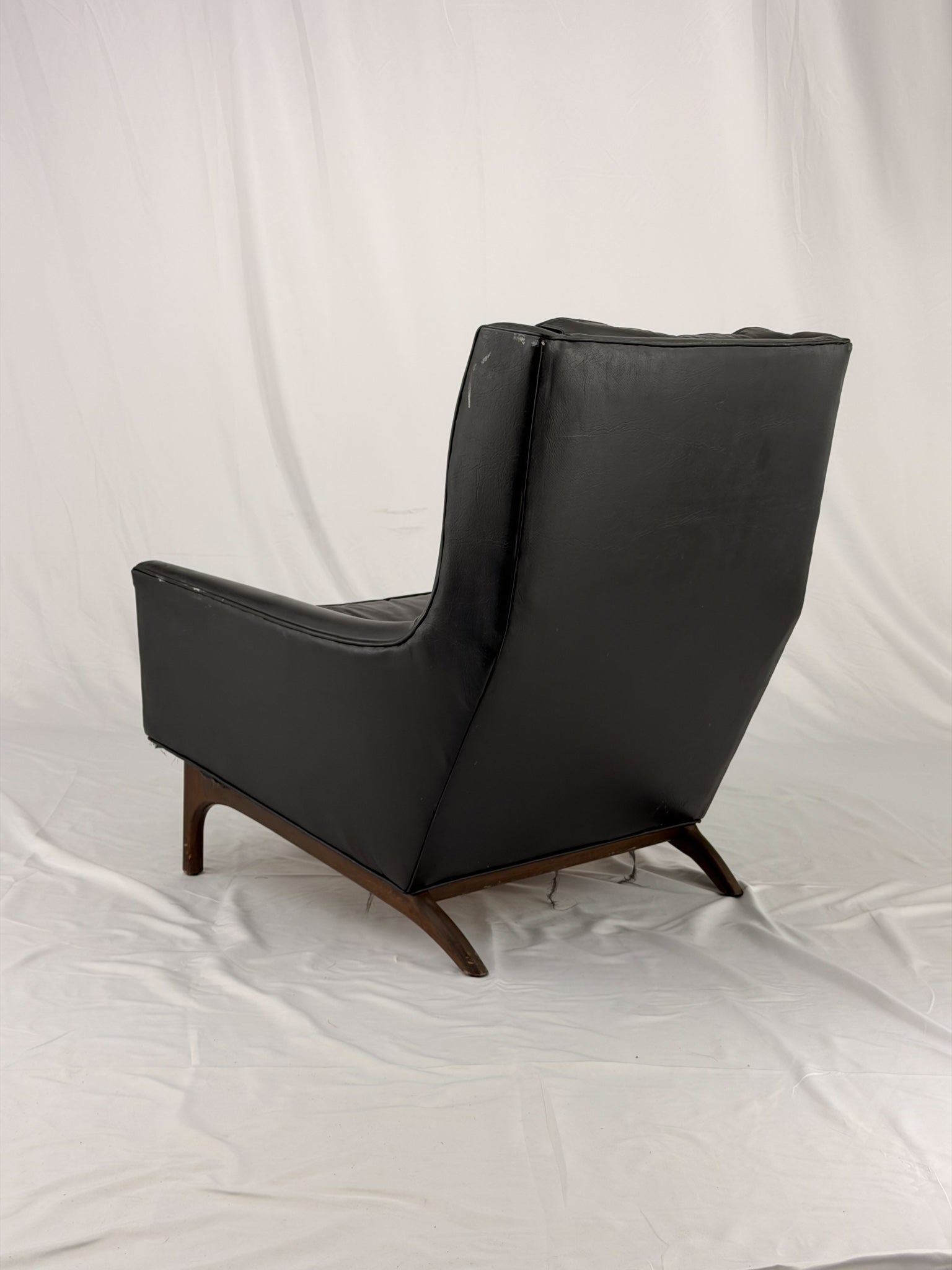 Black leather armchair on a white background