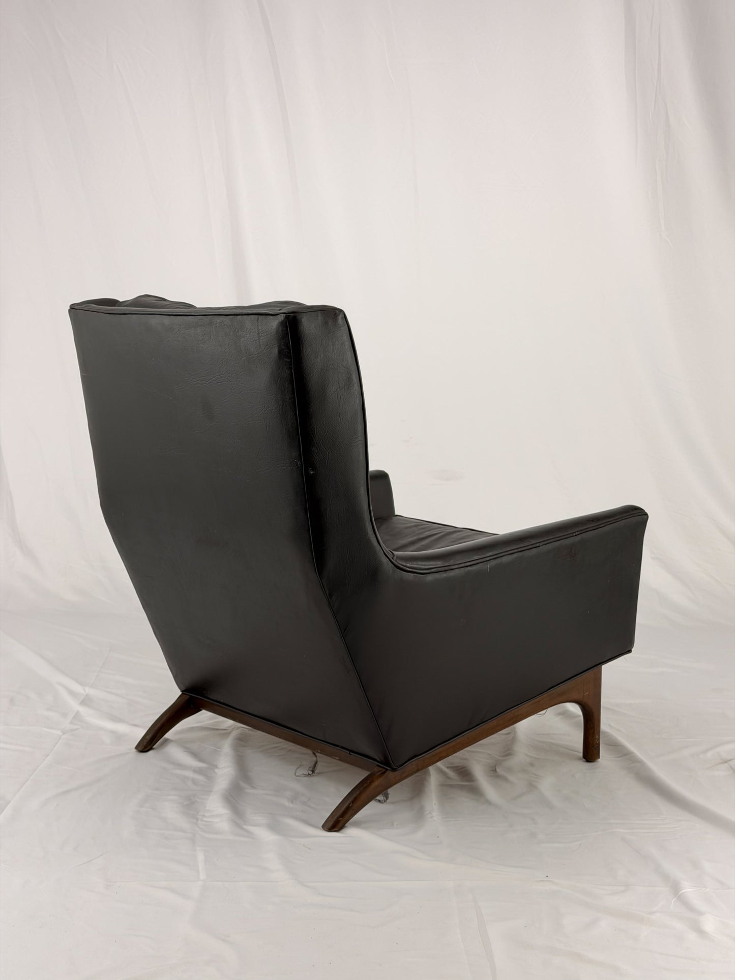 Black leather armchair on a white background