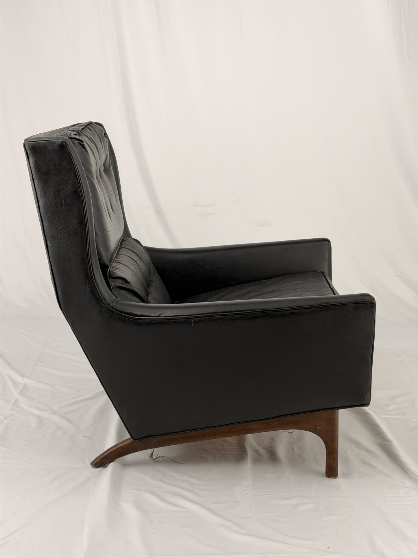 Black leather armchair on a white background