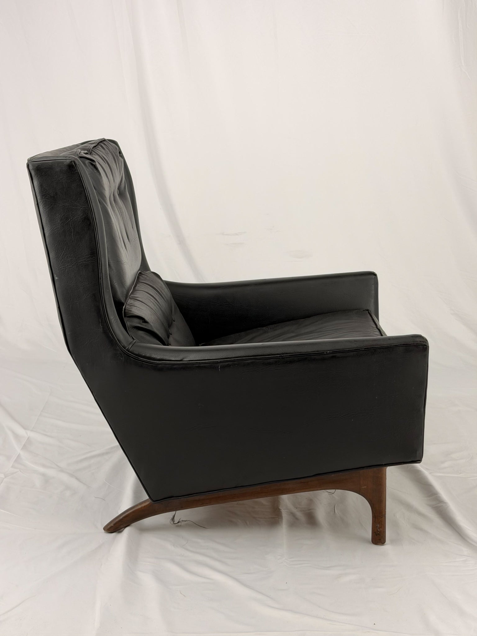 Black leather armchair on a white background