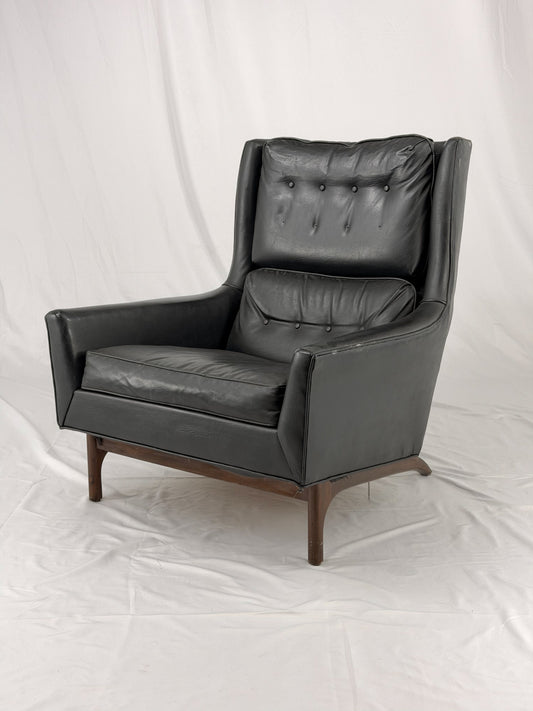 Black leather armchair on a white background
