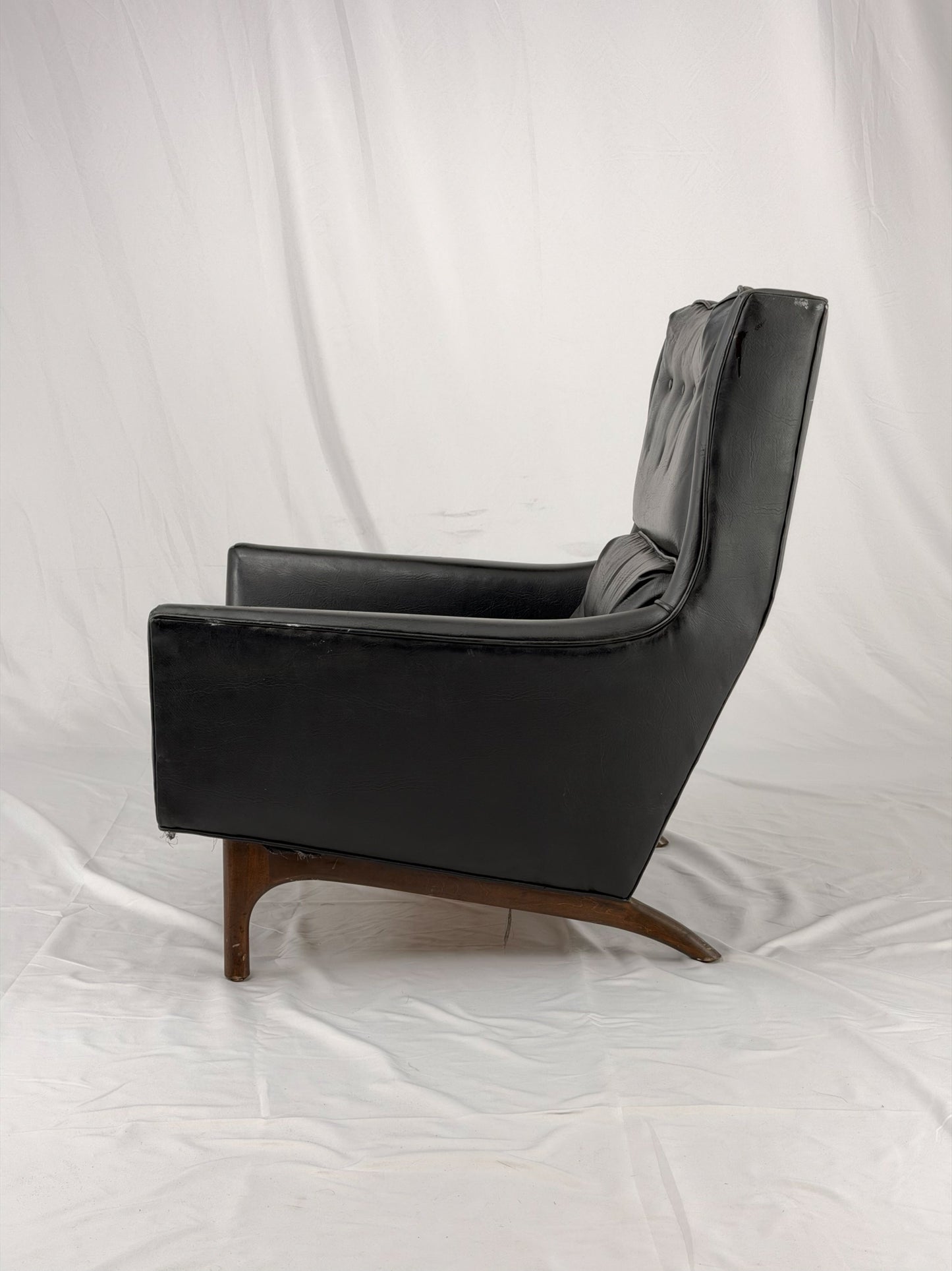 Black leather armchair on a white background