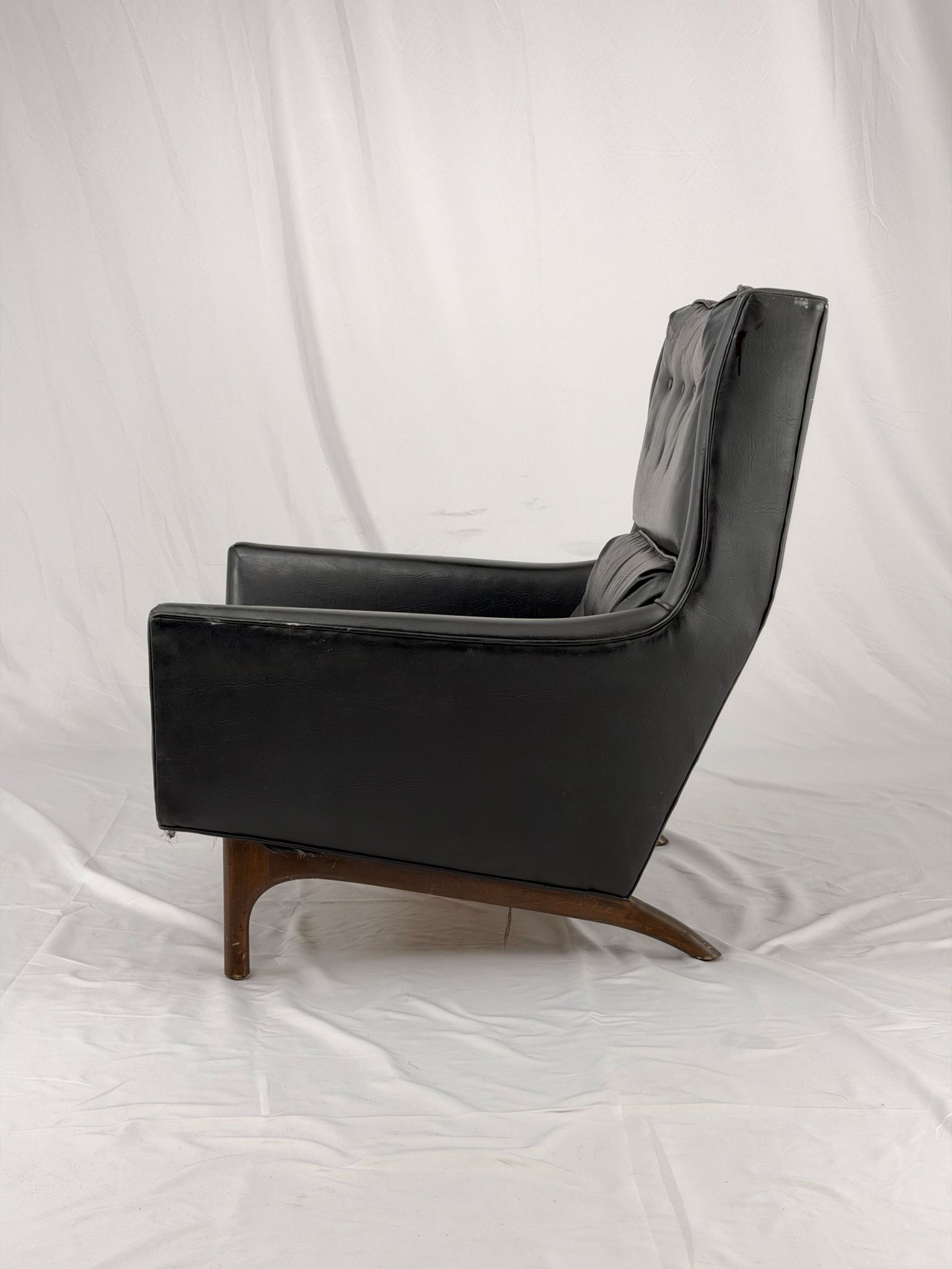 Black leather armchair on a white background