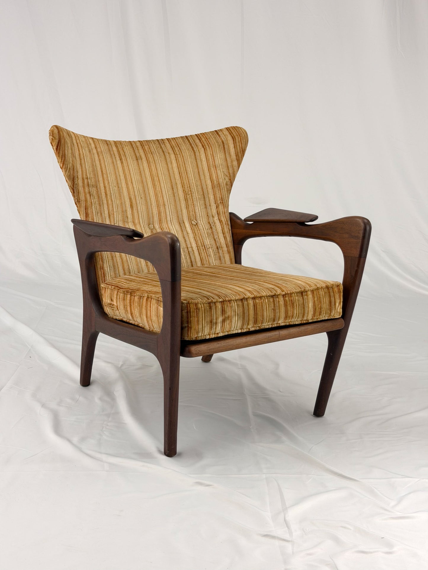 Adrian Pearsall armchair with striped upholstery on a white background