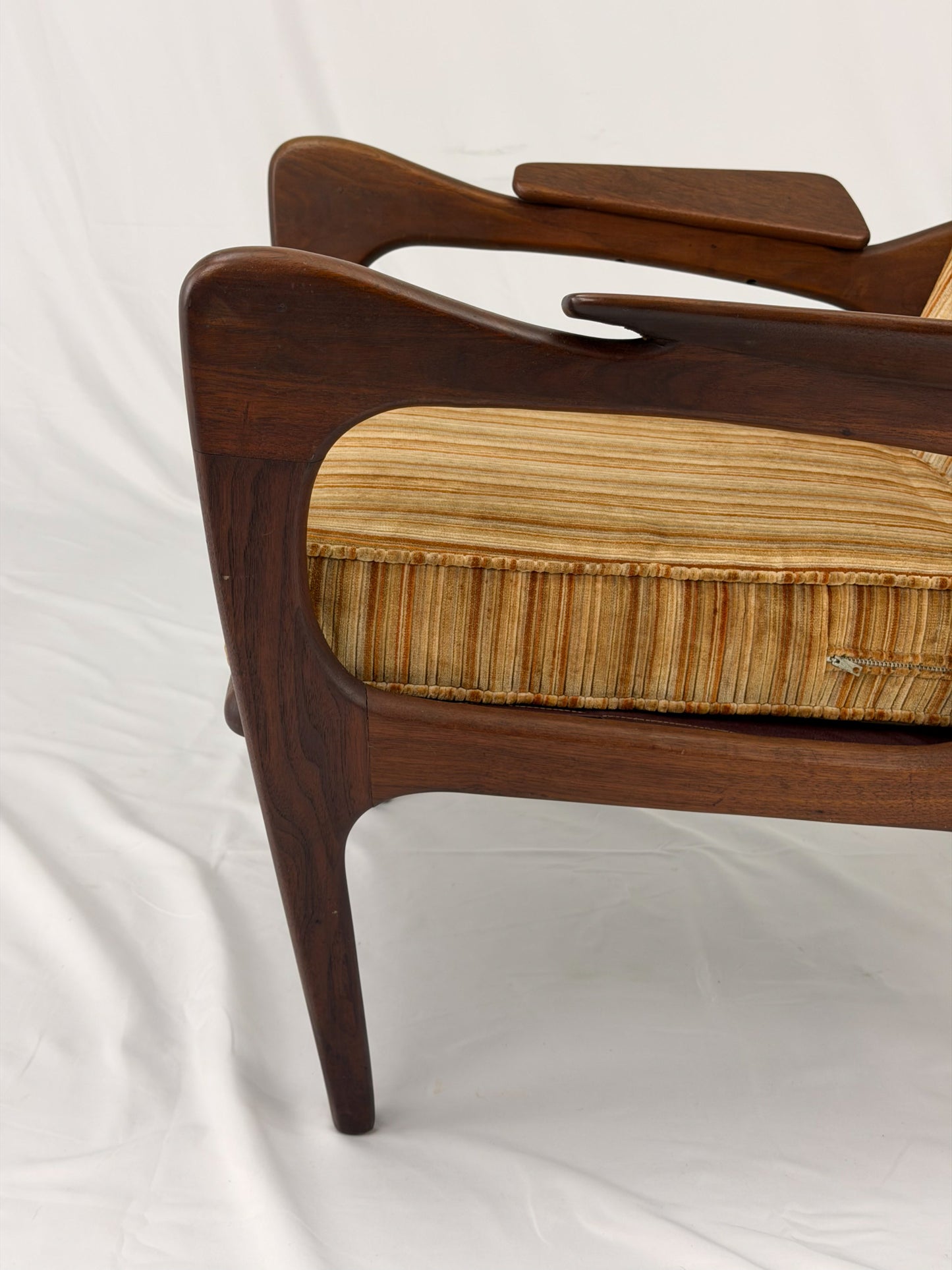 Adrian Pearsall armchair with striped upholstery on a white background
