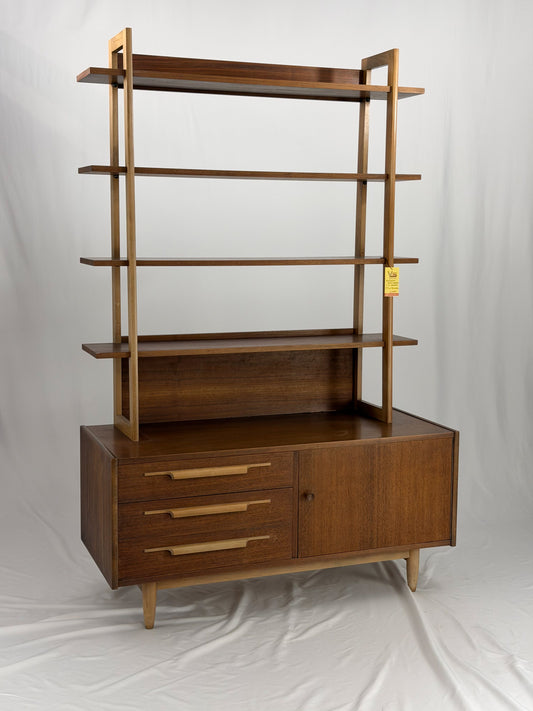 Wooden bookshelf with multiple shelves on a white background