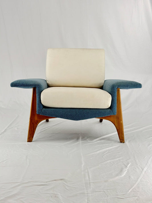 Chair with blue frame and beige cushion on a white background