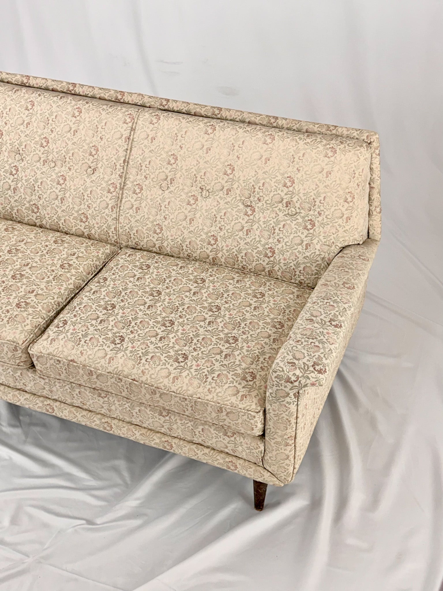 Beige sofa on a white background