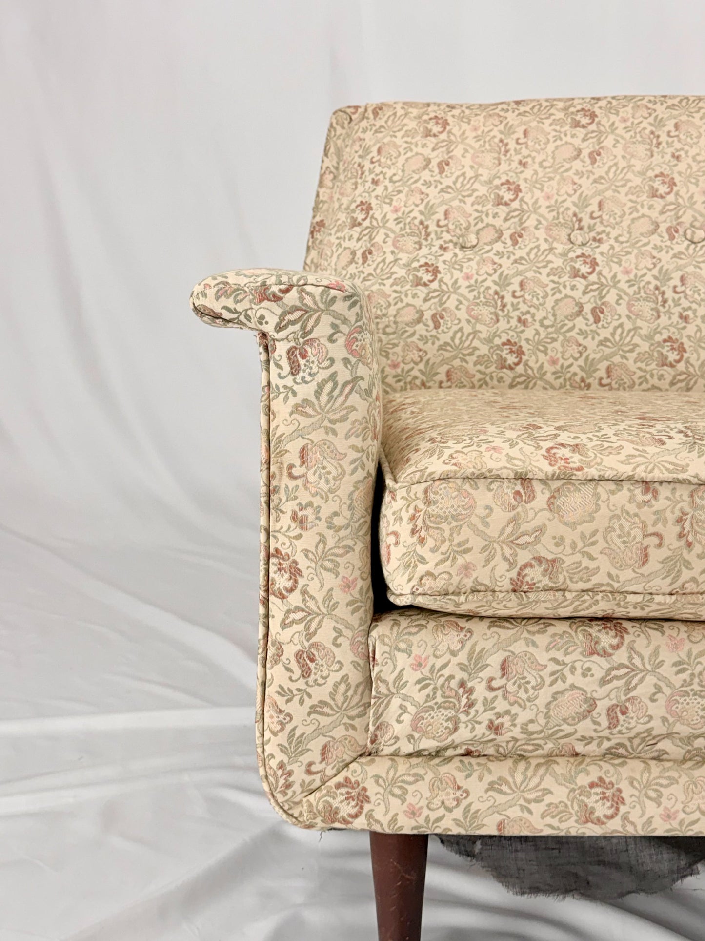 Beige sofa on a white background