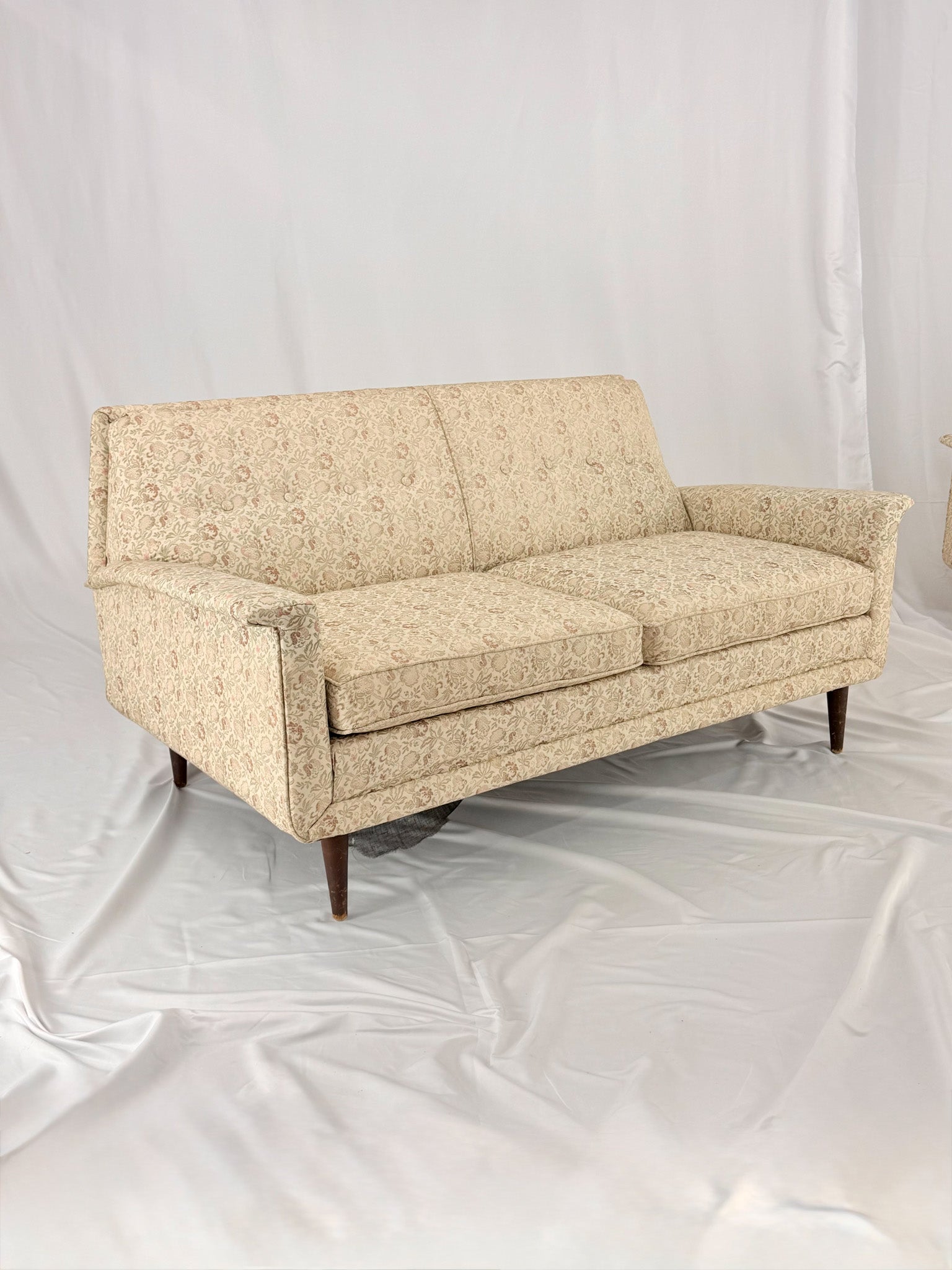 Beige sofa on a white background
