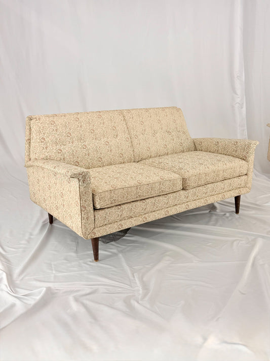 Beige sofa on a white background