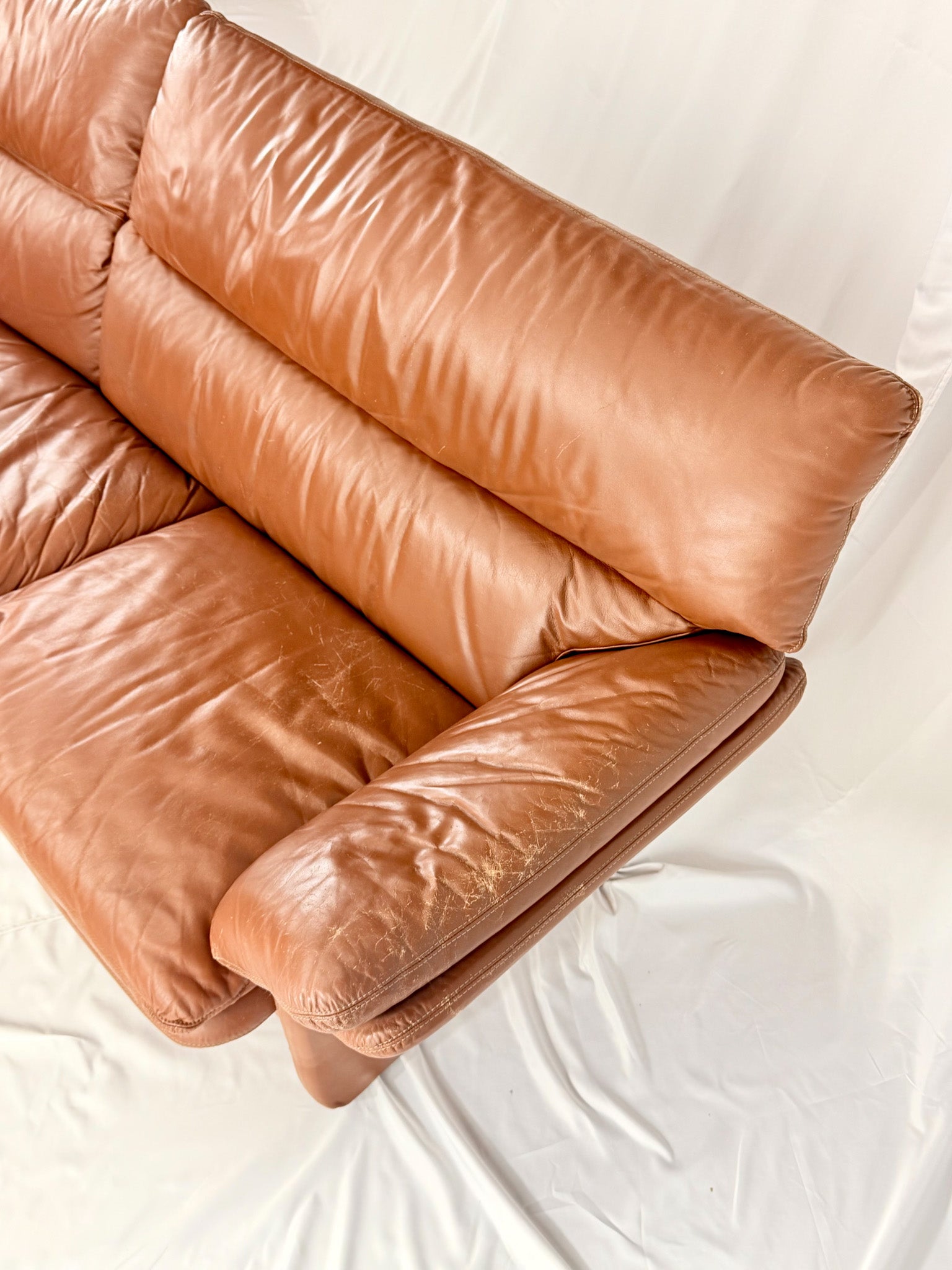Brown leather sofa on a white background