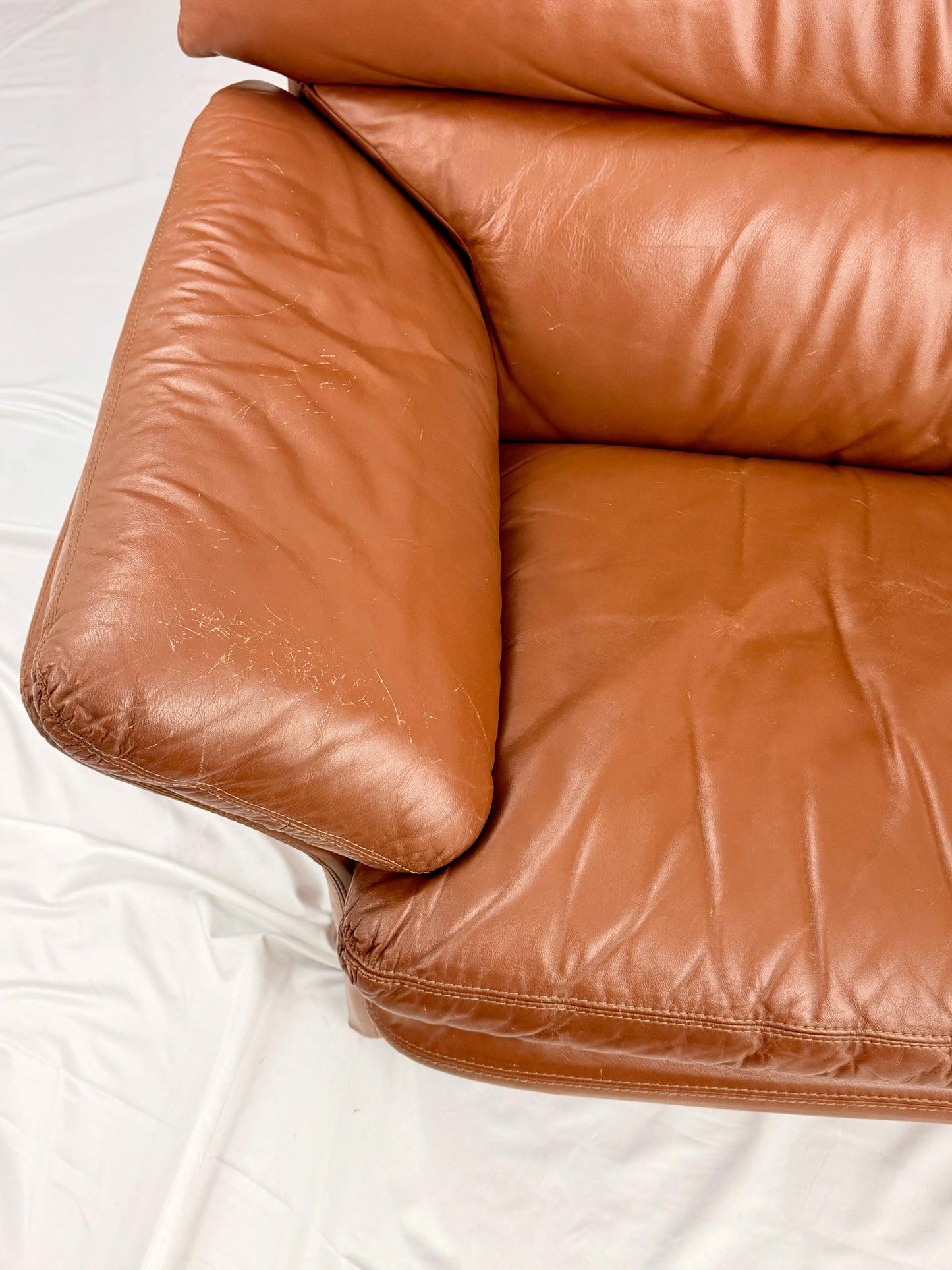 Brown leather sofa on a white background