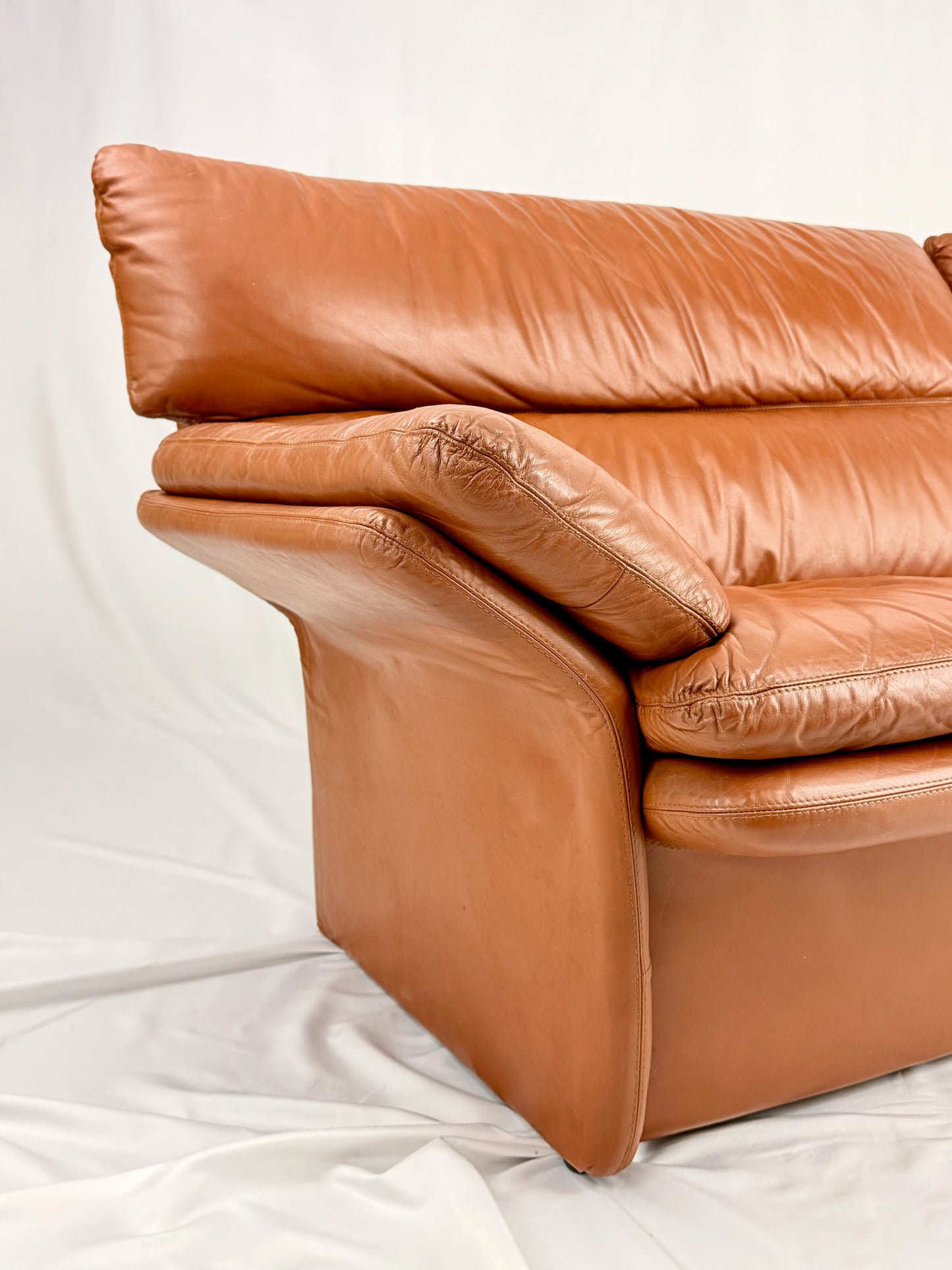 Brown leather sofa on a white background