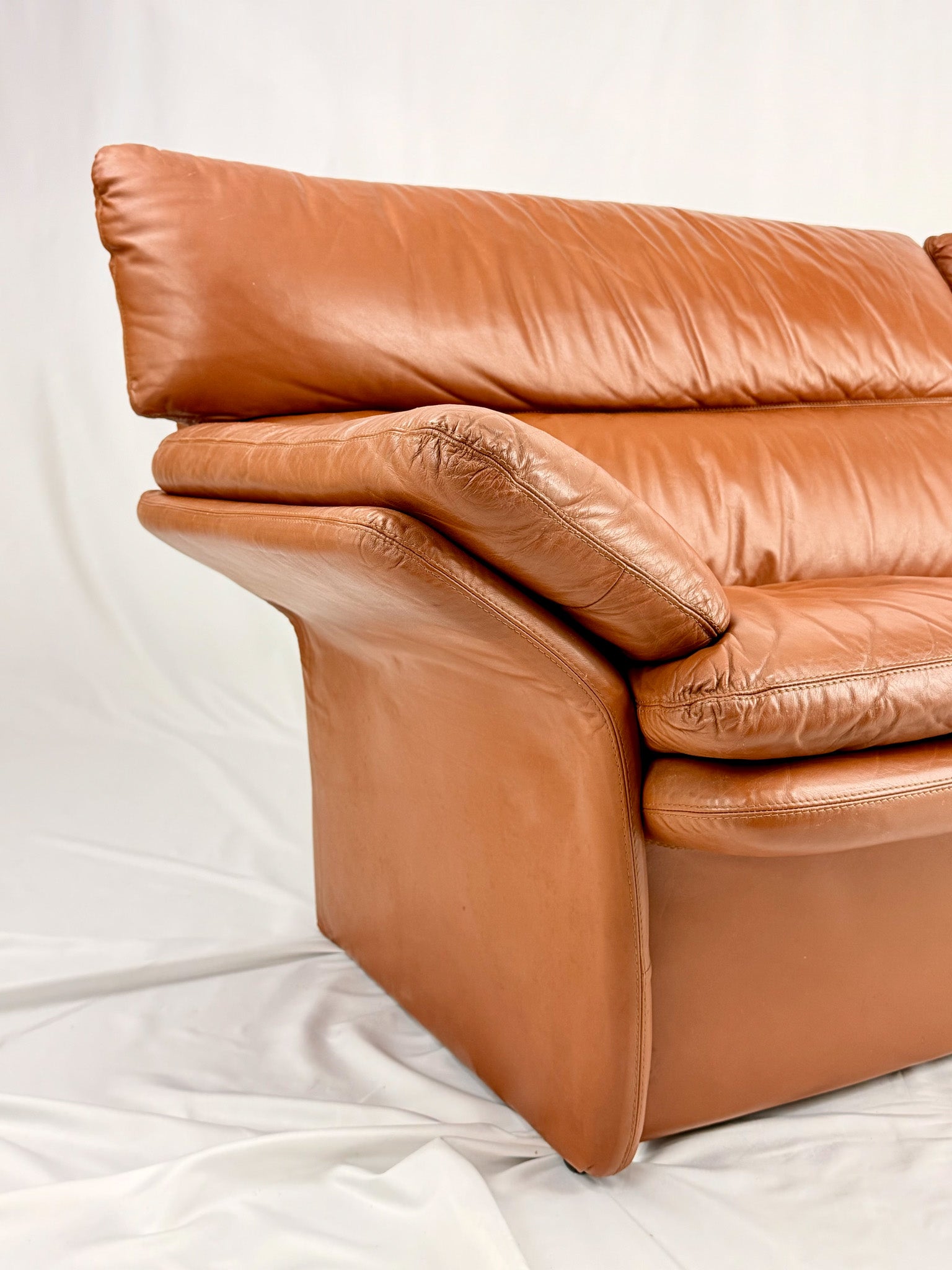 Brown leather sofa on a white background