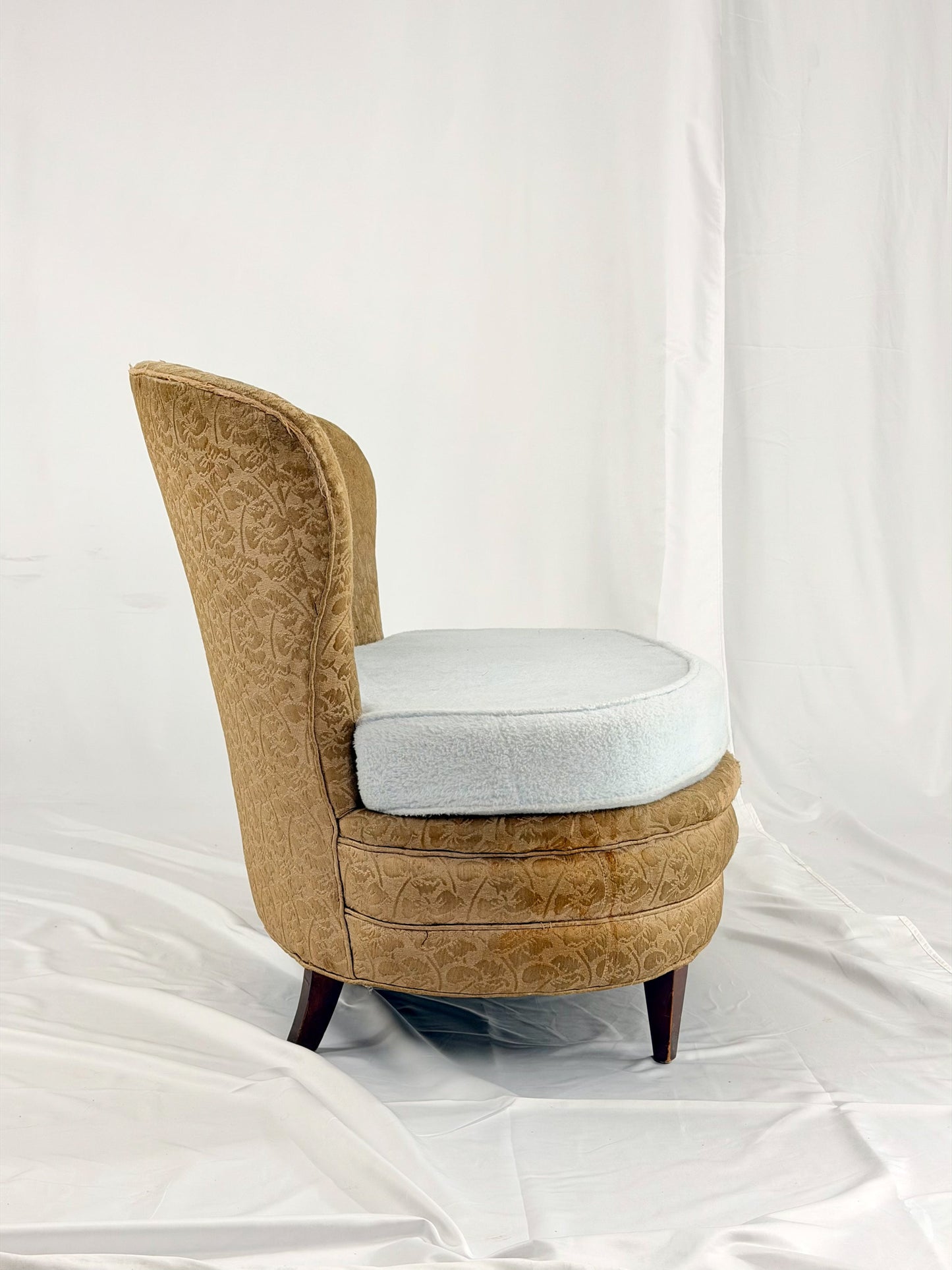 Antique settee with a light blue cushion on a white background