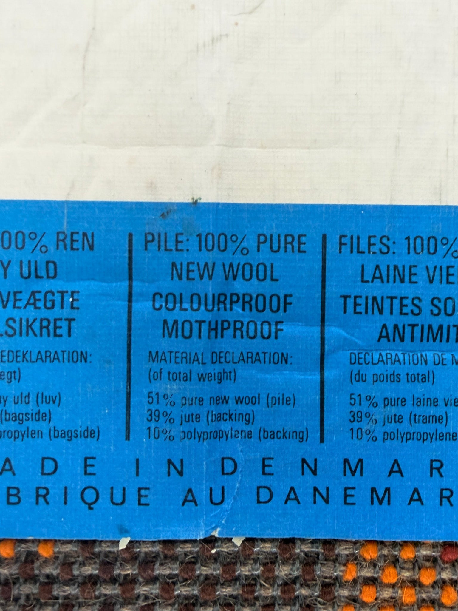 Text label on a fabric with material details and branding