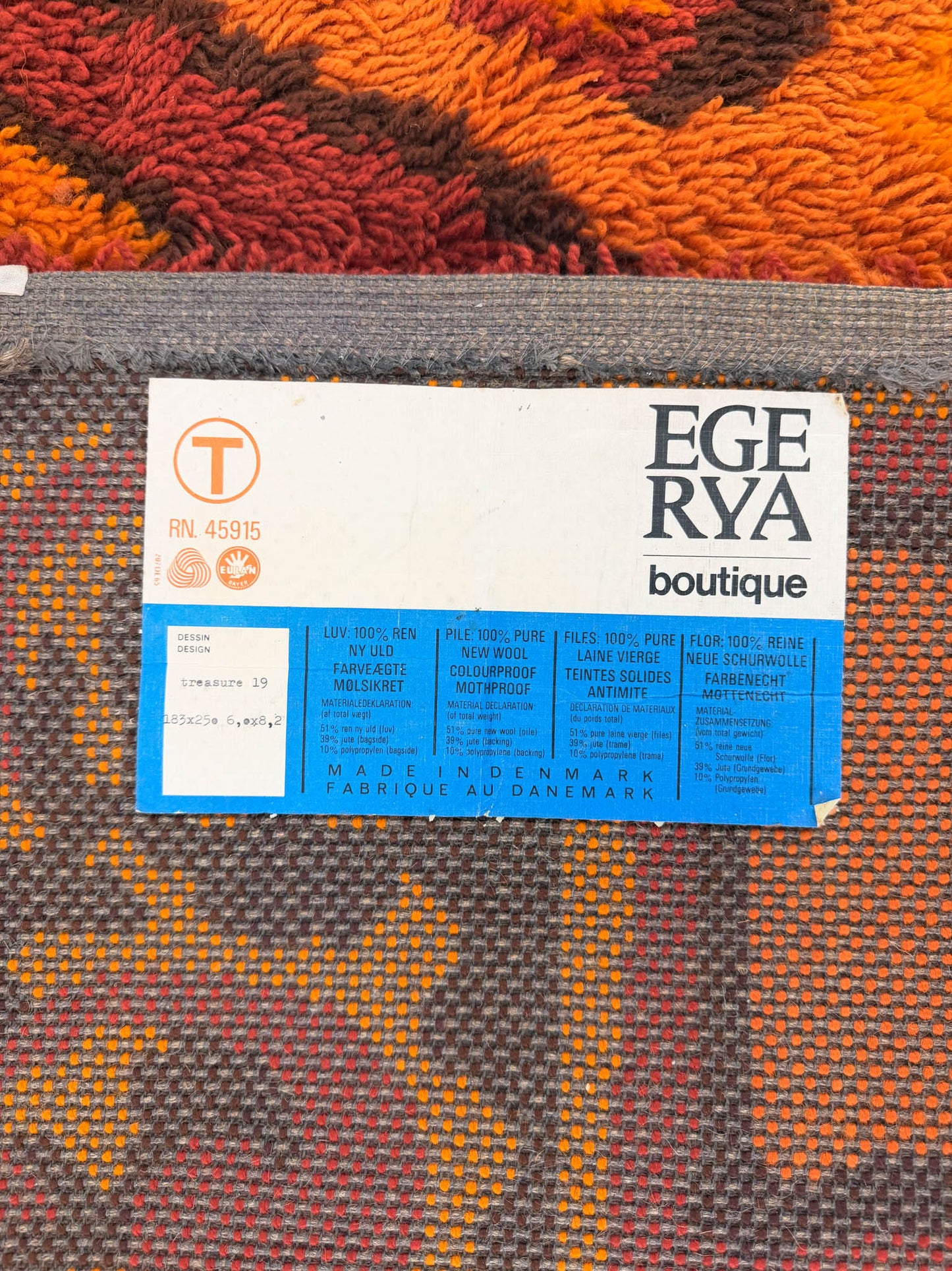 Ege Rya boutique label on a patterned Rya shag rug 