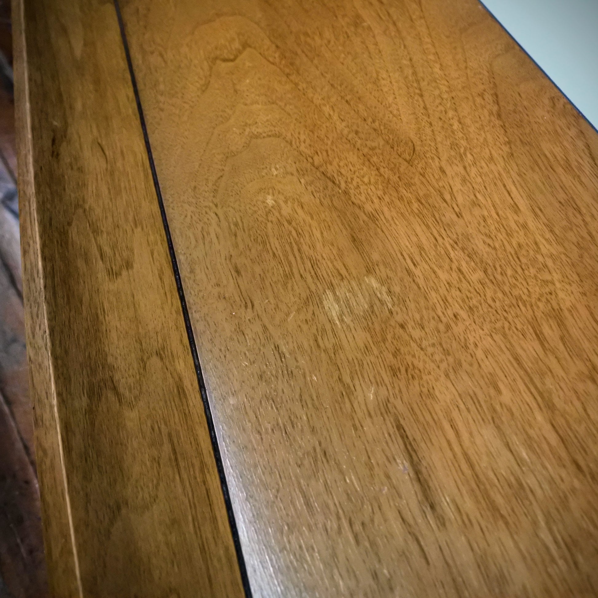 Close-up of a wooden surface with a visible grain pattern